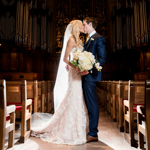 Bride and groom at the ceremony inside a chapel
